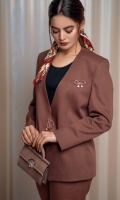 Our refined two-piece rust power suit with collarless finely modified V neckline. Ease fit blazer with ring buckle details at center front. Delicately tailored cropped pants with tapered hem and two front pockets.