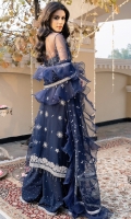 A classy net jacket-cut shirt embroidered in silver "tilla" and hand-embellished with sequins, pearls, glass-cut beads and crystals. Paired with a tulle "dupatta" that is embroidered all over with tilla and embellished with sequins; finished with organza ruffles and crystal tassle details. "Kataan-silk sharara" with hand-embellished crystal spray and embroidered ankle hem. Shimmer chiffon slip included.