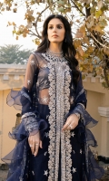 A classy net jacket-cut shirt embroidered in silver "tilla" and hand-embellished with sequins, pearls, glass-cut beads and crystals. Paired with a tulle "dupatta" that is embroidered all over with tilla and embellished with sequins; finished with organza ruffles and crystal tassle details. "Kataan-silk sharara" with hand-embellished crystal spray and embroidered ankle hem. Shimmer chiffon slip included.