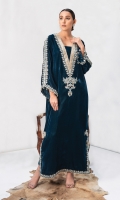 Deena features a navy-teal green Kaftan featuring ravishing embroidered details further enhanced with dainty embelishments and hanging crystal work on the slit; matching raw silk Straight Pants make it a complete look.