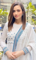 Sana Javed looking absolutely gorgeous in this white pishwas. It is meticulously hand-embroidered paired with white churidar and dupatta to complete the look.