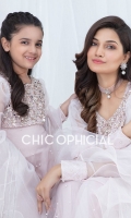 This Beautiful pastel pink High low Ruffle frock is embellished with handwork of pearls sequins and crystals paired up with ruffled organza dopatta styled with flared organza sharara. 