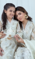Premium Khadi net kurta adorned with golden and white hand blockprinted motifs beautified with embroidered paisley borders and lace details having statement crystal brooch on neckline. Paired up with cottonsilk straight pants which is adorned with laces and organza pleated...