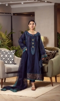 The navy blue kurta is made from pure cotton featuring turquiose and gold embroidery on the neck and is incorporated with gold metallic buttons which is further enhanced with feroza danglings. The kurta is featuring a block printed border on the damaan and sleeves to exude versatile and timeless elegance. It is paired with straight pants and a pure matching organza dupatta featured with tuquiose block printed edgings.