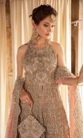The bold and regal ensemble,Jiya is a paneled front open organza gown. It is paired with an organza lehnga with sprawling hand crafted embellishments. An opulent statement design is paired with an accent color dupatta, the perfect hue of pink. Intricately embellished all around the border and glittering spray throughout.