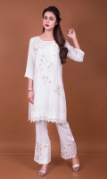 Cotton net shirt with a pretty floral embroidery with pearls and crystals. It has an asymmetrical neckline with crystal buttons and net lace on hem. Take your pick from the soft and subtle white or the fun and bold core to suit your individual taste.