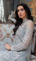 This ice blue long shirt crafted from pure silk organza is heavily ornamented with Crystal's and thread work. This luxurious outfit is finished with raw silk pants and a pearl embellished dupatta for an ethereal look.