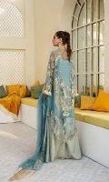 A high low paradise blue jacket with off white and tilla embroidery with sequins consisting of laser cut hanging crystal tassels. Paired with double flared satin and net with intricate embroider trouser and embroided dupatta with satin finishes.