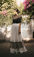 Lawn bodice in black with structured puffy shouldered sleeves and hand spun karandi organza flare comes paired with a cotton lehenga underneath.