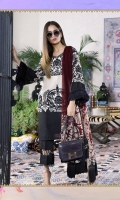 A color-blocked black and cream slub-lawn shirt with a bold Suzani design, offset by modern embroidery patterns on the bodice. Printed sleeves and back with a maroon blend-chiffon dupatta.