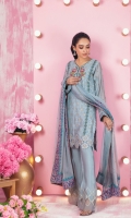 Adorn yourself in this pure jacquard cotton net shirt featuring contrasting silk thread embroidery, enhanced with kundan, sequins and beads, further composed with lace and border details. This shirt is paired with embroidery detailed boot-cut pants and multi colored hand block printed dupatta featuring sequins sprinkles all over finished with gota details.
