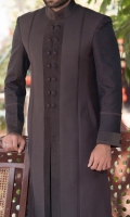 Sherwani stylized with jamawar fabric sleeves and front panel jamawar piping with the contrast of velvet patch work applied on front panel, sleeves and collar with rivets