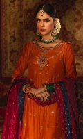 'Itr' is a royal ensemble with a timeless appeal. The vibrant rust hue of the heavily flared kalidaar gives a luxurious feel, further enhancing the delicate handwork of gemstones, zardozi and aari on aesthetically composed damask and jewelry motifs on the neckline, daman and sleeves. The accents of pink and blue, with cutwork on daman and pleated net finishing adds to the opulence of the ensemble. The frock is paired with a contrasting cherry pink pure banarsi silk dupatta with embroidered tassels on corners. The look is complete with pure raw silk rust churidar and an embroidered rust pouch with doori- tassel finishing which can be separately ordered from separates section.