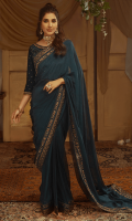 Anisa is a tissue silk saree that shimmers with its intricate screen printed border with gold hand work and a beautifully hand crafted blouse in velvet. It is hand embellished with kora, dabka and zari with the accent of hot pink and dhaani, draped to perfection in varying hues of teal, giving it a timeless and elegant look.