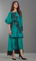 This regal emerald green shirt embellished in Swarovski Crystals on the front is beautifully highlighted with asymmetrical ruffled sleeves and finished with an embellished border on the back and sleeve.