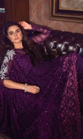 Dazzle in this lopsided purple cape decorated with hand embellished silver motif on one side and finished with embroidered border all around. Coordinate the look with short bell bottoms emphasized with embroidered border.