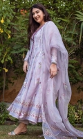 A Lavender organza net hand blocked Angarkha Kalidaar paired with structured straight raw silk pants and organza blocked dupatta.