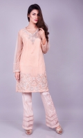 Always look pretty with this soft and beautiful net shirt in a soft peach with delicate embroidery on hem and neckline adorned with zardozi and crystals.
