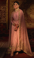'Rukhsar' is a mauve hand embellished in gold and copper zardozi with rosey pink resham details, the classic pure raw silk pishwas still remains a popular choice for wedding wear. A heavily and exquisitely detailed embroidered bodice, flare, boarders and classy sleeves are paired with organza mauve dupatta and it has intricate hand embroidered borders along with Chan booti and raw silk green paltawa paired with pure raw silk mauve churidar. A customized pouch can be added to the outfit upon request.