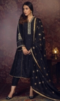 'ZYRA'' A high class A-line kalidar outfit incorporated with pure raw silk fabric infused with heavy hand embroidery of kora, dabka, zaari and aari on the overlap neckline with detailed embroidery on sleeves with spray of sequins on the flared paneled kalidar and finishing it off with lace edging at the daman. It is paired with pure silk screen printed gold dupatta with the edging gold lace for the finishings.