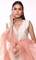 In a classic kurta silhouette. The self embossed ivory shirt is highlighted with intricate embroidered neckline decorated with touch of mirror work that instantly enhances the beauty of this outfit. It comes with ivory ijaar pants detailed with printed border and lace at the bottom. The voguish ruffled dupatta in pink organza makes the outfit more elegant.